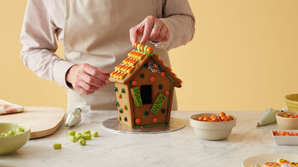 How to make a Halloween gingerbread house: top with candy