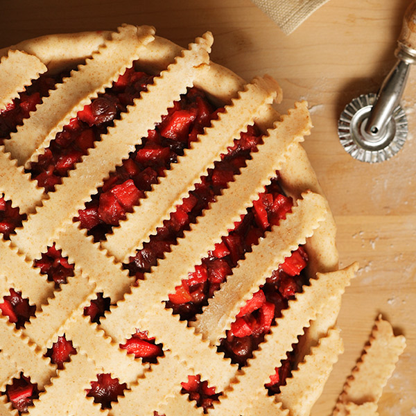 Fruit pie topped with a lattice cream cheese pie crust.