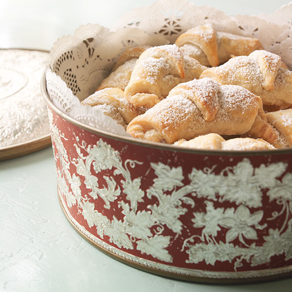 Vanillekipferl, or crescent cookies, dusted with a light layer of powered sugar.