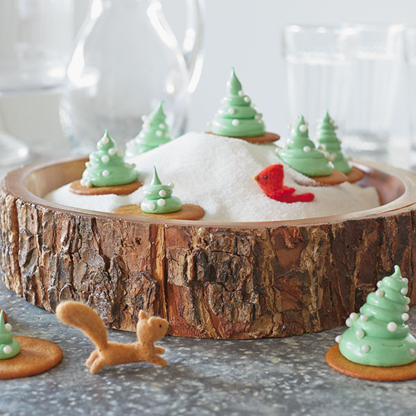 Green Christmas meringue cookies shaped and decorated like Christmas trees.