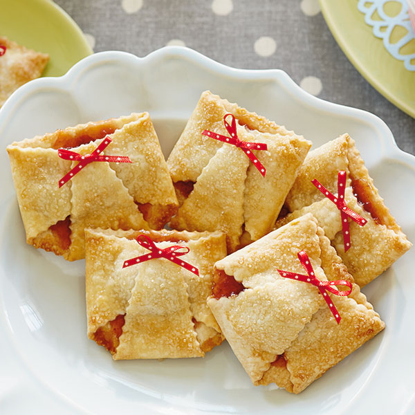Strawberry tarts shaped like diapers for a baby shower dessert.