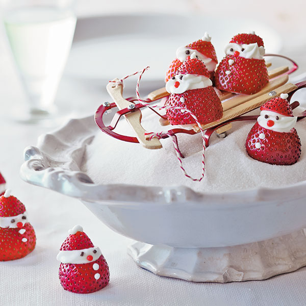 Strawberry Santas in a sleigh with mascarpone heads and gel icing details.