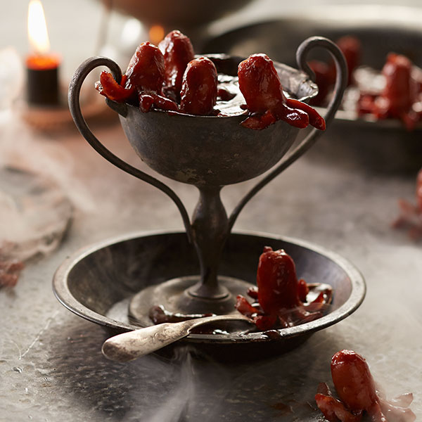 Halloween little smokies shaped like tentacles of a creature and placed in barbecue sauce.