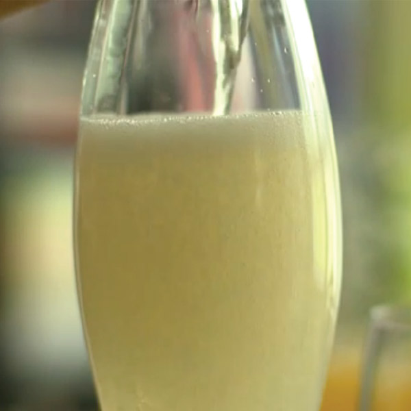 Bubbly French 75 cocktail in a champagne flute.