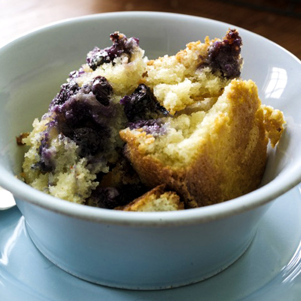 Blueberry boy bait in a bowl with fresh blueberries, buttermilk cake and rich streusel.