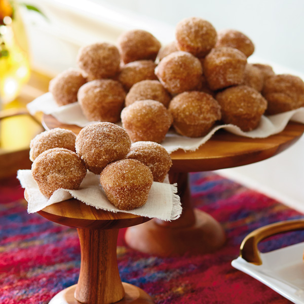 Bite-sized apple cider donut holes coated in cinnamon sugar.