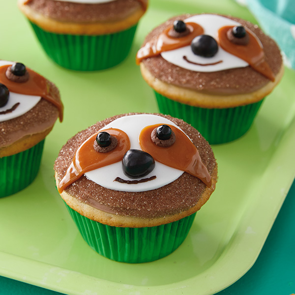Sloth cupcakes with chocolate frosting, caramel eyes and candy details.