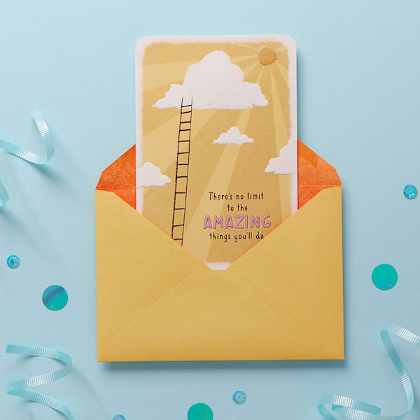 Good luck card sticking out of an envelope.