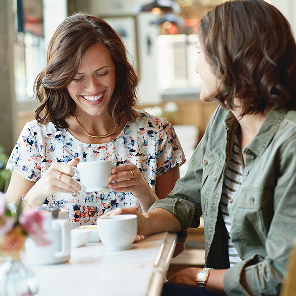 Two women having coffee together.