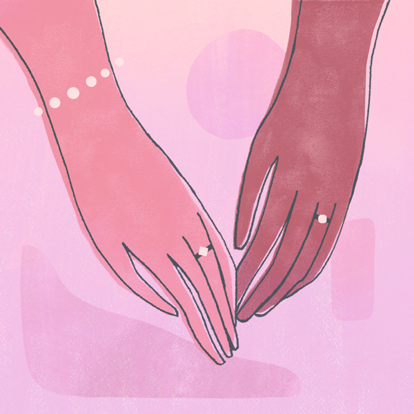 two women holding hands