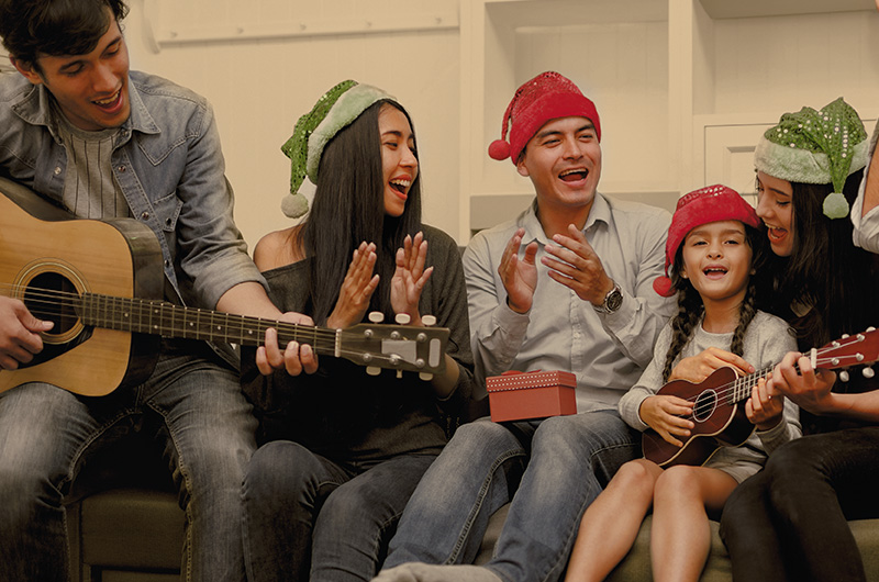 Family singing - Latinx Christmas Traditions and Holiday Celebrations