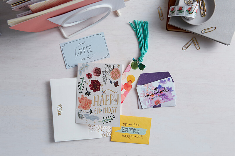 Greeting card with tuck in gifts on a white background
