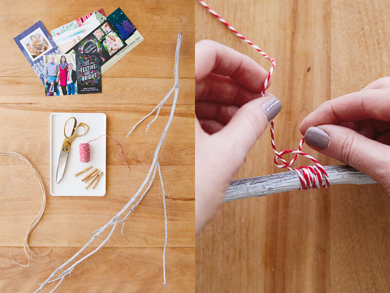 A wide shot of the winter branch Christmas card display, and a close-up of tying string to the branch.