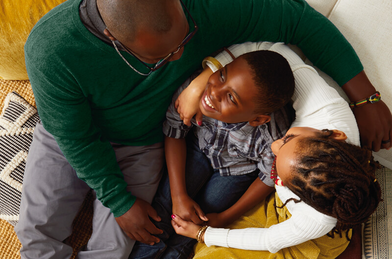 A family looking at and embracing each other.