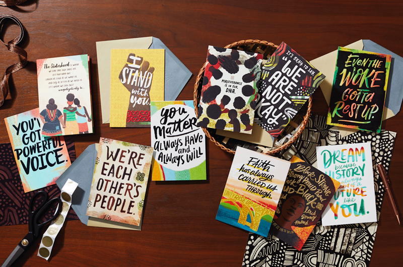 Uplifted & Empowered collection cards on a table
