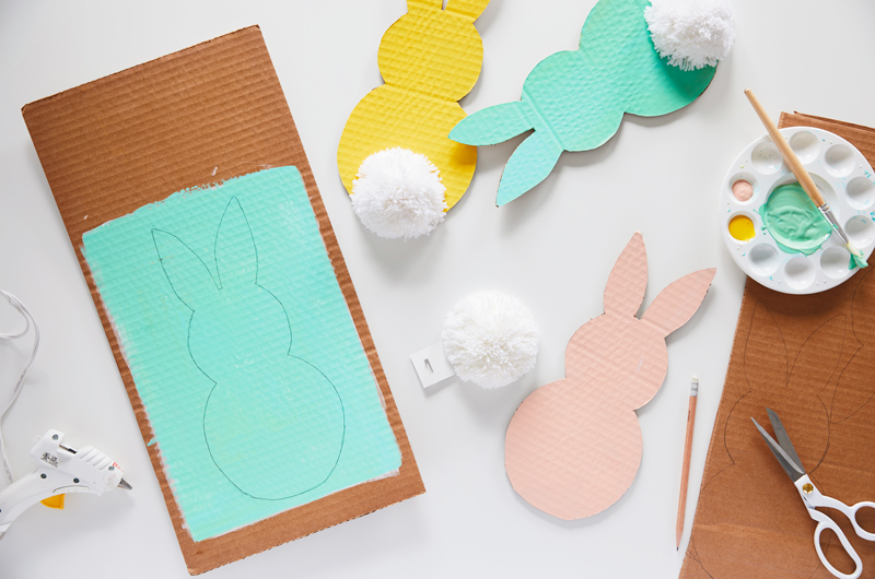 Making cardboard Easter bunnies with paint and craft supplies