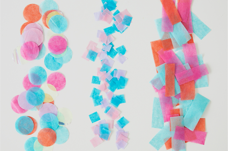 different types of confetti on a white background