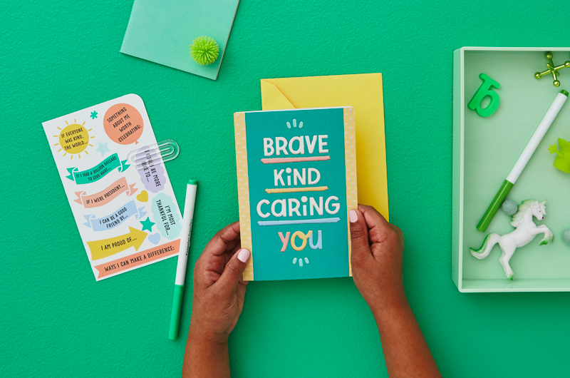 Kid hands with card and envelope
