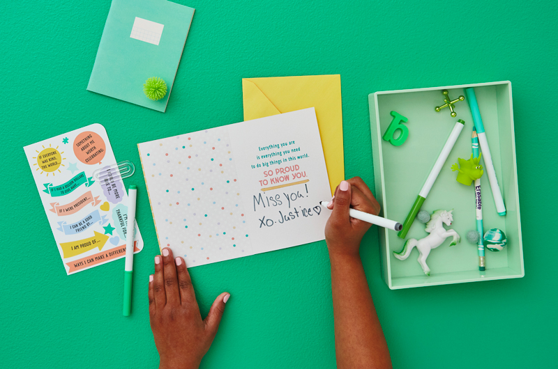 Kid writing in card