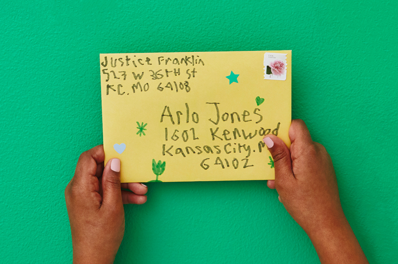 Kids hands holding envelope