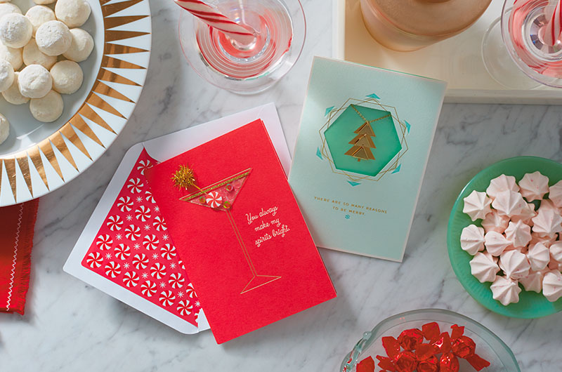 Treats on platters and Christmas cards on a table