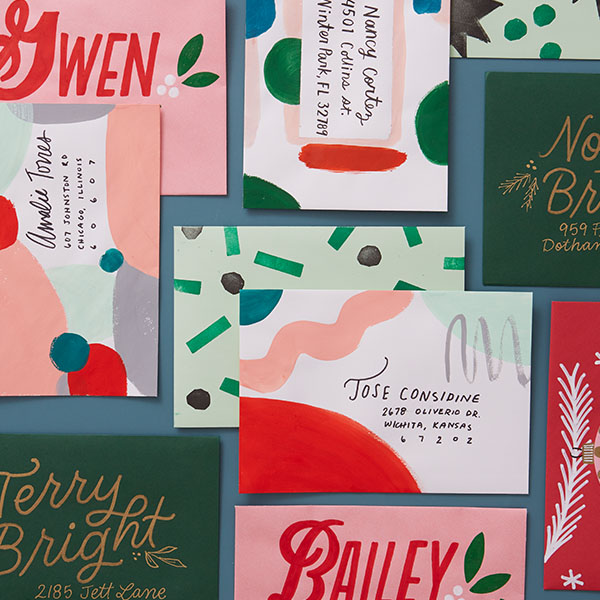 Christmas cards decorated with paint, stamps and hand-lettering.