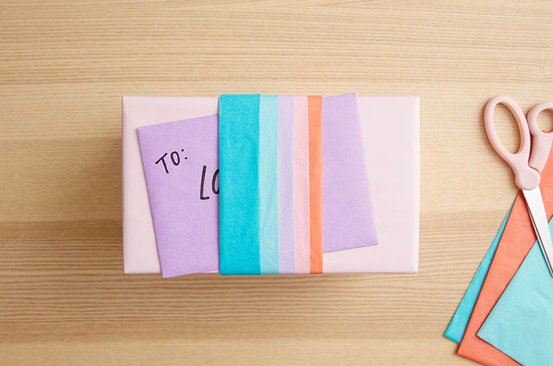 tissue paper band holding a card