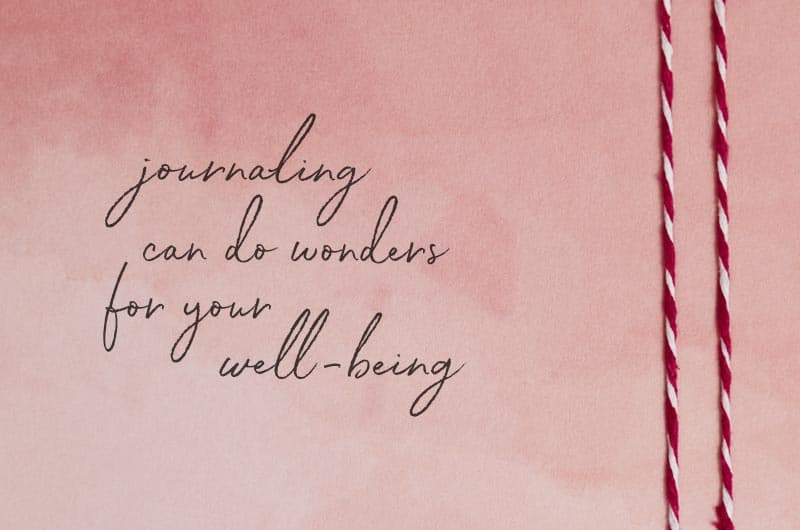 A piece of paper stained pink with watercolor that reads,