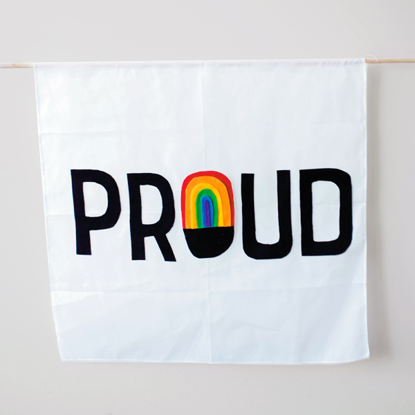 A white DIY pride flag with the word