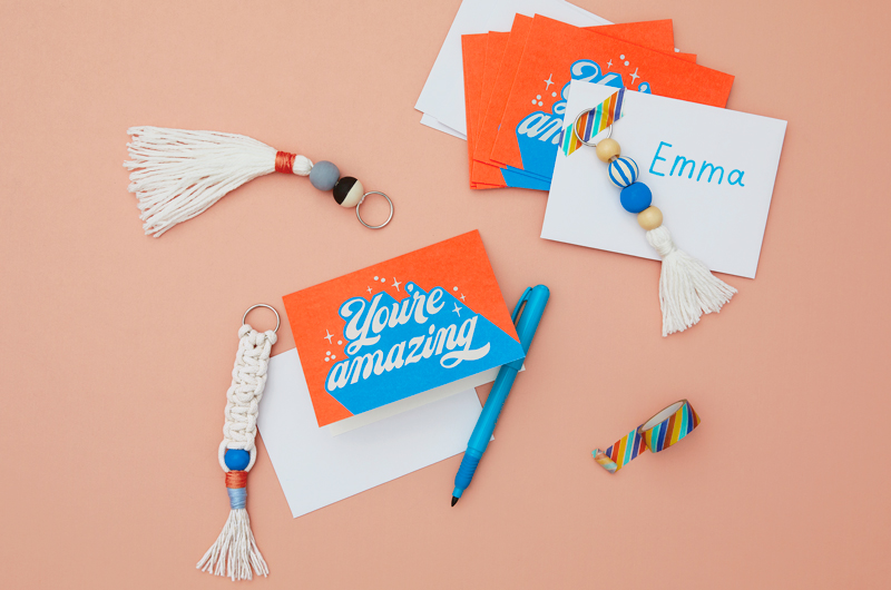 A bright orange card that reads
