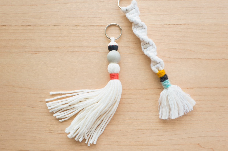 A beaded macramé keychain with a long tassel and a half-knot macramé keychain with short tassel.