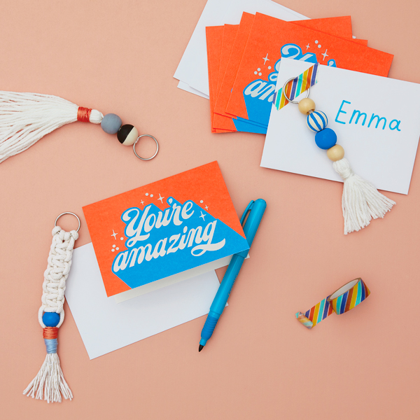 A bright orange card that reads