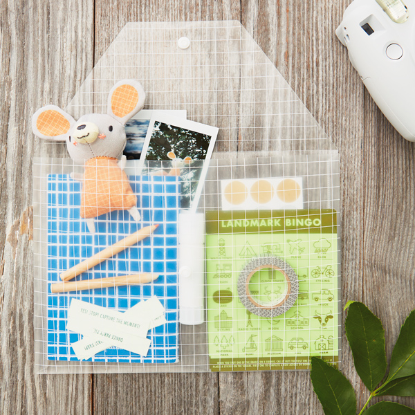 Hannah's DIY road trip games kit, tucked inside a clear plastic pouch.