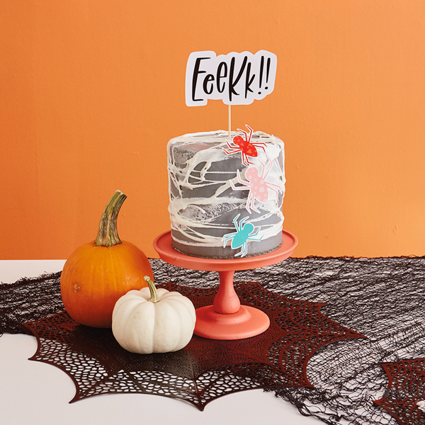 A gray cake with white marshmallow