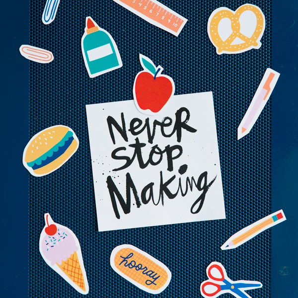 An array of our DIY back-to-school magnets scattered on a dark blue surface.