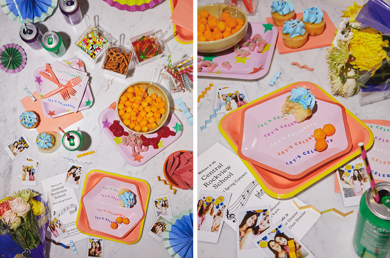 Two downshots of a table set up to celebrate a the completion of a high school performance; on the table top are Celebrate! plates in different shades of light orange and pink with a star pattern, as well as flowers, salty snack foods like cheese puff balls and open cans of soda with paper straws inserted in them.