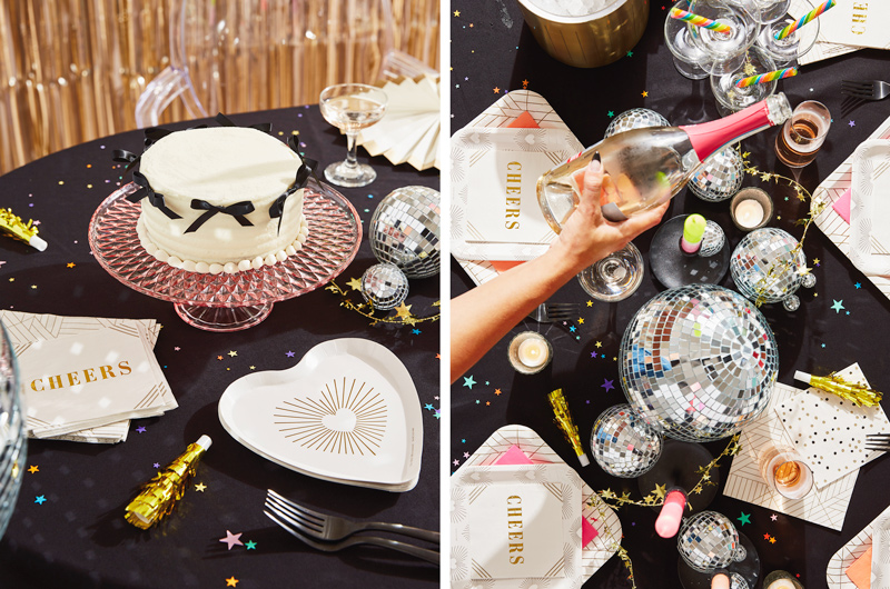 A New Year's Eve tablescape featuring Hallmark Celebrate! partyware, like cream-colored cocktail napkins that have