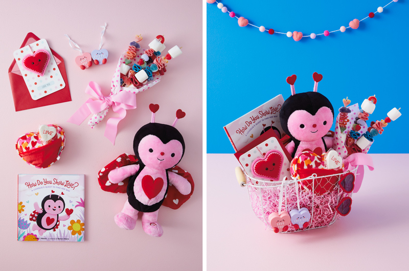 A collection of Valentine's Day gifts and treats for kids including an interactive ladybug plush with matching book, a heart shaped pillow with a pocket, a bouquet made of candy skewers, a Better Togethers ornament featuring two magnetic candy conversation hearts, and a kids Valentine's Day card featuring a removable plush ornament.