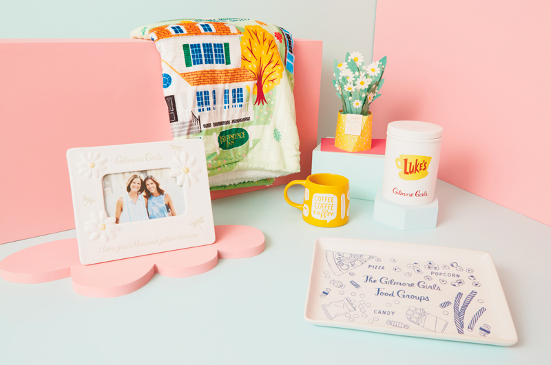 Gifts for a parent who loves Gilmore Girls that includes a white, ceramic frame with daisies on it and reads,