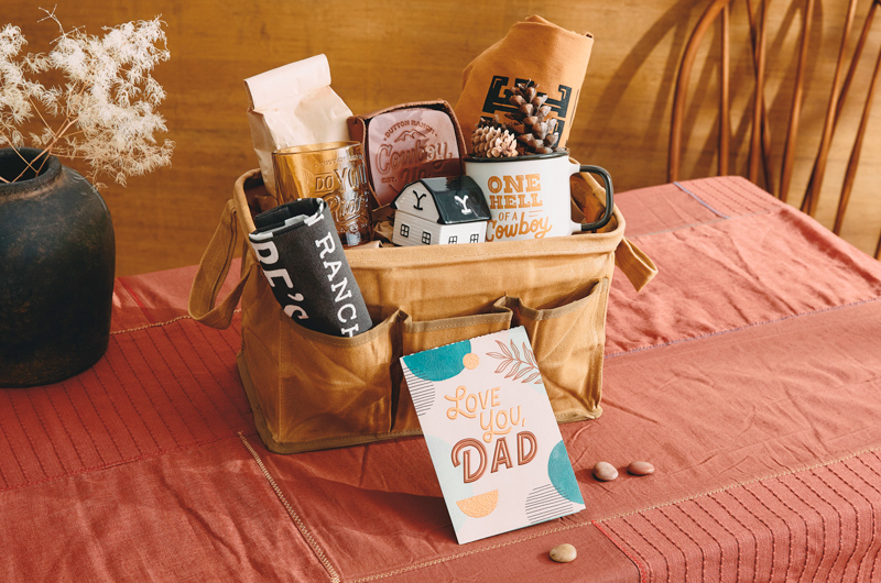 A DIY Father's Day gift basket with a TV's Yellowstone theme, including a card that reads,
