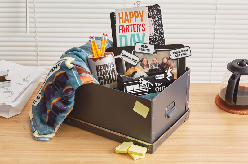 A DIY Father's Day gift basket in the form of a file box that's filled with gift products from Hallmark's The Office collection, including a mug that reads,