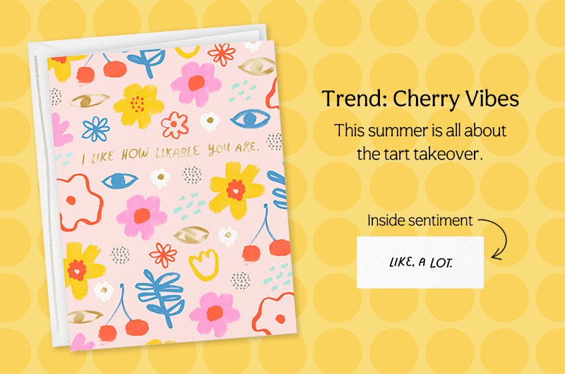 A bright, cheerful greeting card with illustrations of cherries on the front and a sentiment that reads,