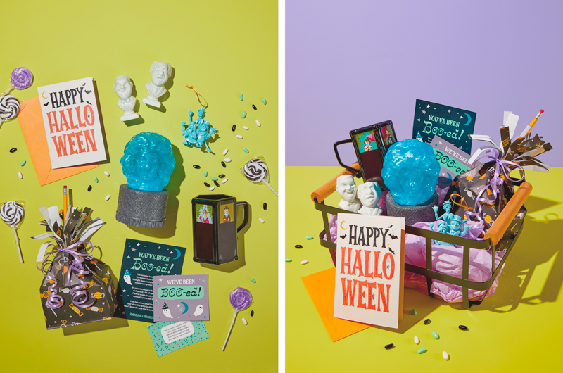A collection of gifts for a Disney The Haunted Mansion boo bag, including a Madame Leota water globe, a color changing portrait mug, a Hitchhiking Ghosts ornament, and Singing Busts salt and pepper shakers.