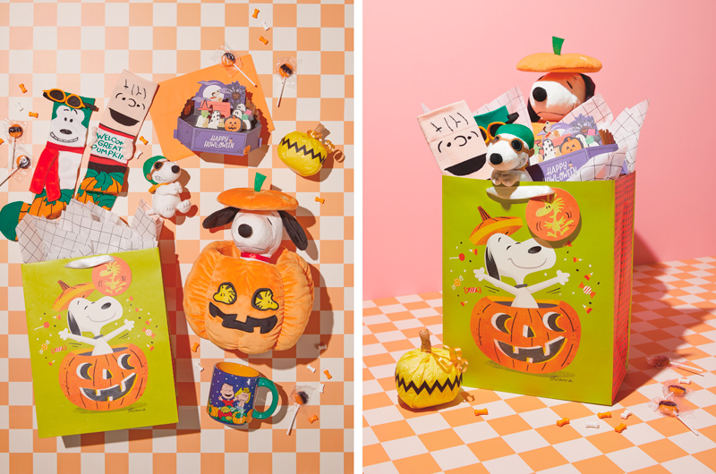 A collection of gifts for a Peanuts Halloween-themed boo bag, including a pair of Linus and Snoopy novelty socks, an interactive 